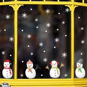 Detail view of colorful hand-drawn snowmen stickers and snowflakes on window display
