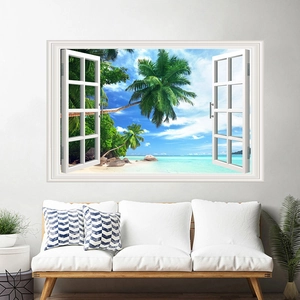 Detail of 3D window wall decal with tropical beach view above a white fabric sofa