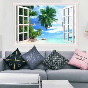 3D window wall decal featuring a tropical beach and palm trees over a living room sofa