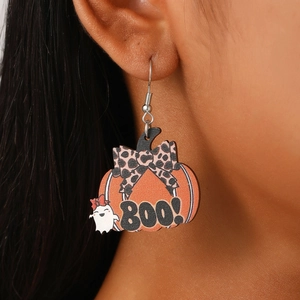 Close-up of Halloween wooden earrings with leopard bow pumpkin and white ghost boo detail