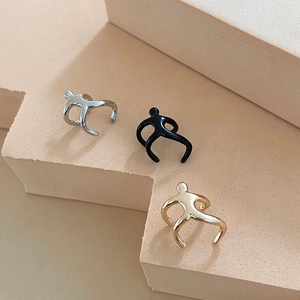 Minimalist abstract human-shaped ear bone clips in silver, black and gold finishes