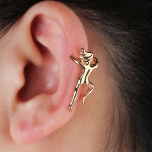 Detailed view of creative golden human shape ear cuff climber on person ear