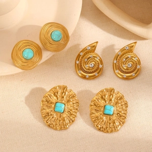 Detail of 18k gold plated stainless steel earrings with green turquoise and rhinestones
