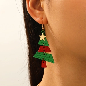 Macro view of Christmas tree dangle earrings with red and green tiered festive design