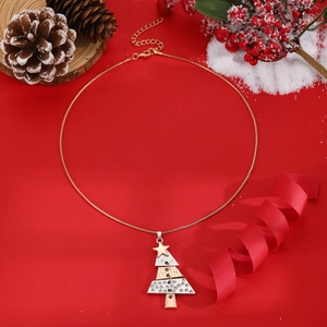 Detailed view of festive Christmas tree necklace with sparkling rhinestones and gold chain