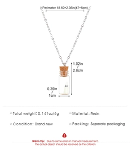 Detailed view of glowing ghost resin pendant in glass bottle with silver chain dimensions