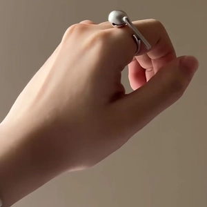 Unique minimalist silver Muyu ring with a creative geometric ball and bar design for stress relief