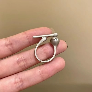 Unique geometric silver fidget ring with stress-relief pressable ball and matte finish
