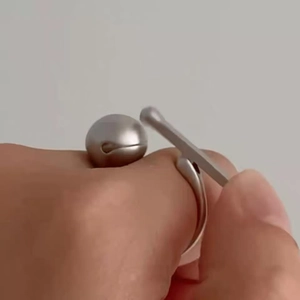 Mechanical fidget ring in matte silver finish with movable wooden fish striker design