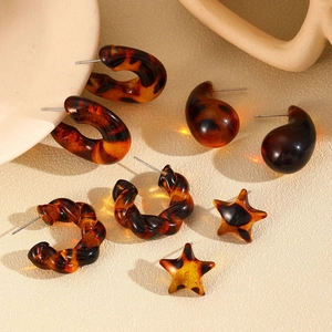 Detailed view of leopard tortoise shell resin earrings in four geometric shapes and patterns