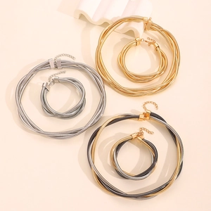 Multi-layered snake chain necklace and bracelet set in gold silver and tri-color finishes