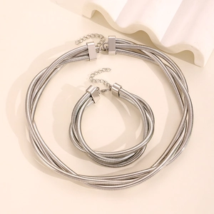Detail view of silver triple-layered spring snake chain jewelry set with lobster clasps