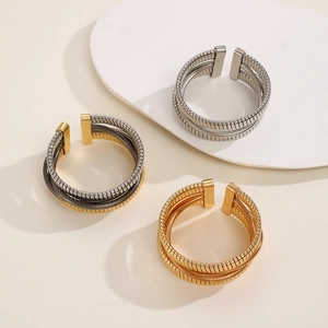 Three-layer metallic spring coils in gold and silver finish with minimalist display