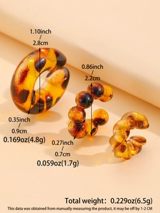 Detailed view of amber leopard print resin earrings set with dimensions and weight info