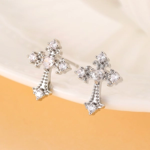 Silver cross stud earring with white heart zircon and sparkling pavé stones