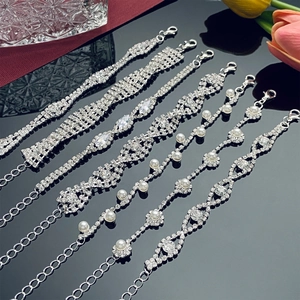 Elegantes pulseras de diamantes de imitación en plata con cristales y perlas