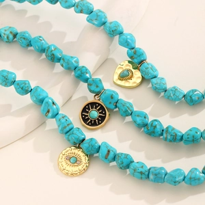 Bohemian multilayer necklace featuring turquoise beads and golden evil eye charms