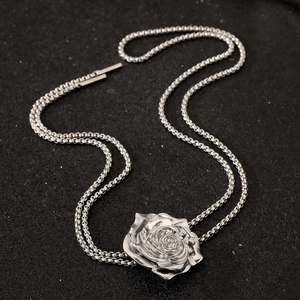 Polished silver metal necklace featuring a 3D rose pendant on a dual-chain design