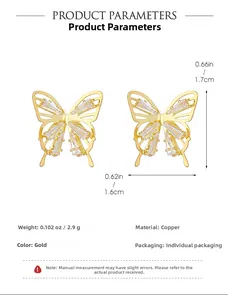 Detail view of gold butterfly earrings with cubic zirconia stones and size measurements