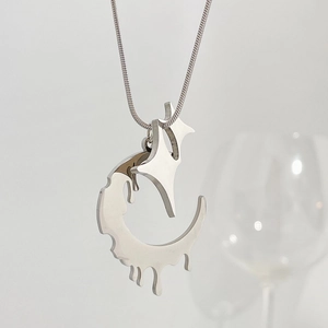 Close-up of silver stainless steel molten heart necklace with abstract lava pendant