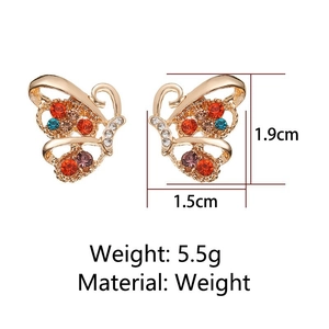 Detailed view of colorful rhinestone butterfly earrings in gold finish with size markers