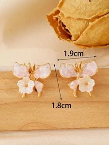 Detailed size view of rhinestone butterfly earrings measuring 1.9 cm wide and 1.8 cm high