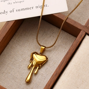 Golden lava melting heart necklace with fine snake chain made of stainless steel