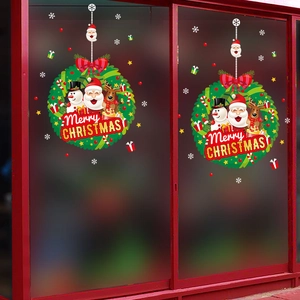 Christmas window decals with Santa, snowman and reindeer in festive wreath design