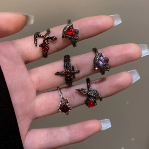 Gothic punk ring set featuring red gemstones and black metal crow motifs