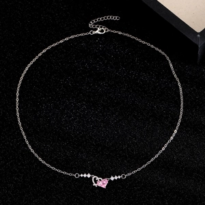 Detail view of pink heart pendant with zircon accents and adjustable lobster clasp