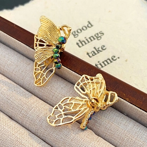 Elegant gold butterfly earrings with hollow wings and colorful beads for women