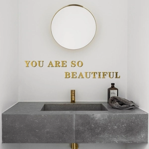 Golden acrylic 3D mirror wall stickers featuring You Are So Beautiful quote in bathroom