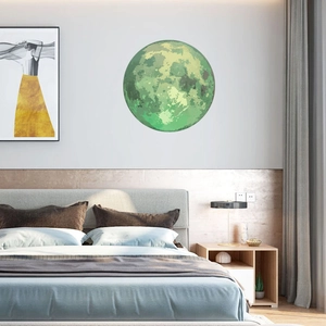 Luminous green moon wall sticker in a modern bedroom setting for home decoration