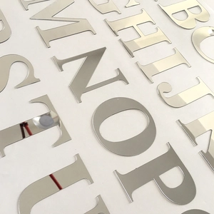 Macro detail of 3D silver acrylic mirror alphabet letters with reflective surface