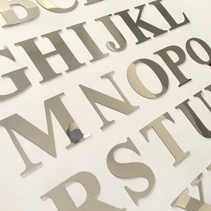 Macro shot of silver acrylic mirror alphabet letters for DIY wall decor signage