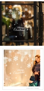 Detailed Christmas window stickers with white snowflakes and Merry Christmas lettering