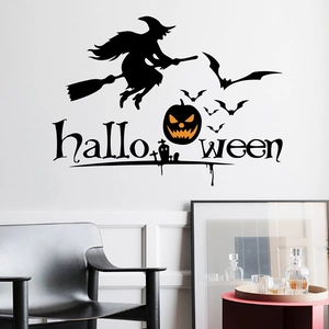 Halloween wall decal featuring a witch on broom, pumpkins and bats on white wall
