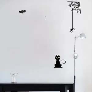 Close-up of Halloween PVC wall stickers featuring black cats, pumpkin and spider web