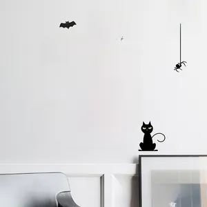 Detail of Halloween wall stickers with Happy Halloween text, bats, and orange pumpkins