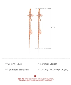 Detail of 8cm tassel star drop earrings in rose gold copper with white zircon stones