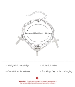 Detailed specs of silver double layer chain bracelet with cross and eye charms