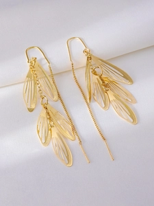 Close-up of S925 silver hallmark on gold-plated hollow leaf tassel long earrings