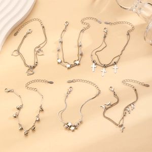 Y2K style stainless steel bracelet set with heart, star, cross and dolphin charms