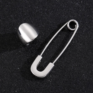 Polished stainless steel paperclip earrings set for men on a black textured background