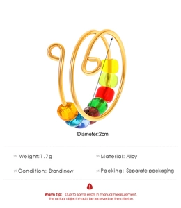 Detailed view of rainbow bead rotating ring with 2cm diameter and 1.7g weight info