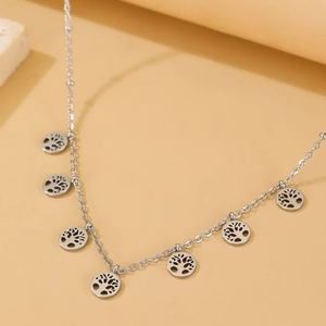 Silver stainless steel Y-shaped necklace featuring seven Tree of Life hollow pendants