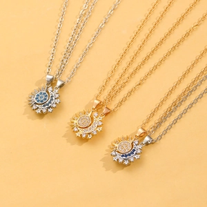 Detailed view of magnetic sun and moon necklaces with sparkling crystals in three colors