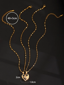 Detail of magnetic sun and moon heart necklaces with dimensions 2cm and 40cm chain