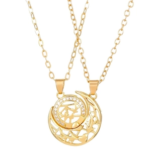 Magnetic sun and moon couple necklace set in gold with white cubic zirconia accents