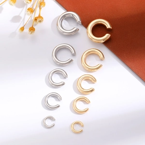 Detail view of 10-piece C-shaped alloy ear cuffs in five sizes, gold and silver finishes
